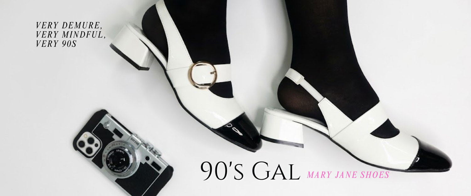 Black and white 90s-style Mary Jane shoes with a vintage camera on a white background.