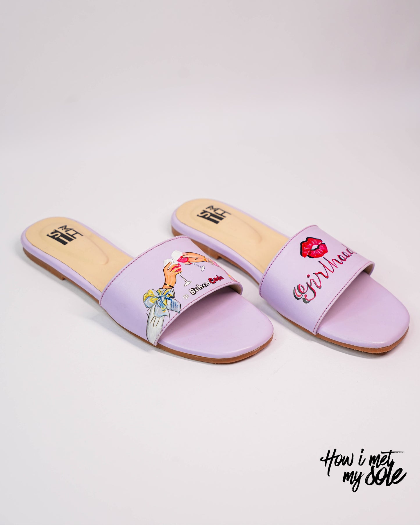 Pair of lavender hand painted slides on a light gray background