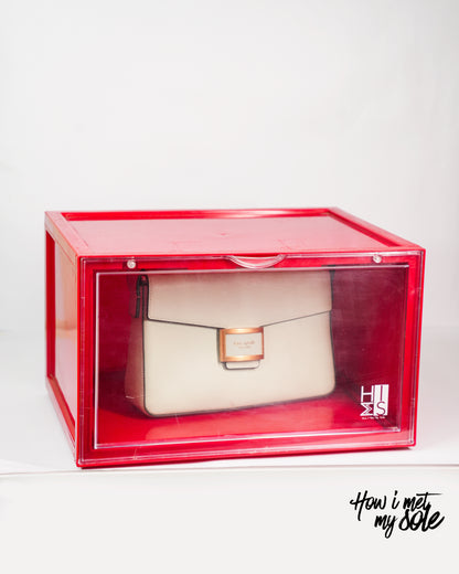White luxury handbag inside a red style safe storage box with 'How i met my sole' branding
