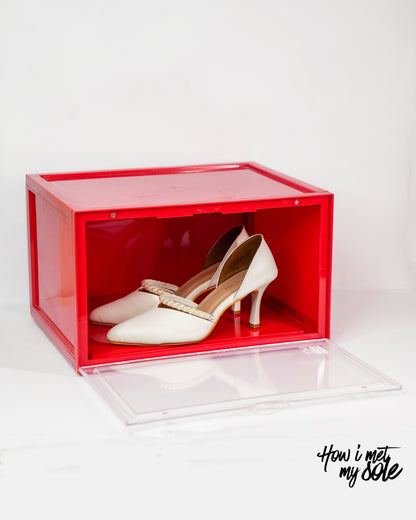 Red style safe storage box with white luxury high heels inside