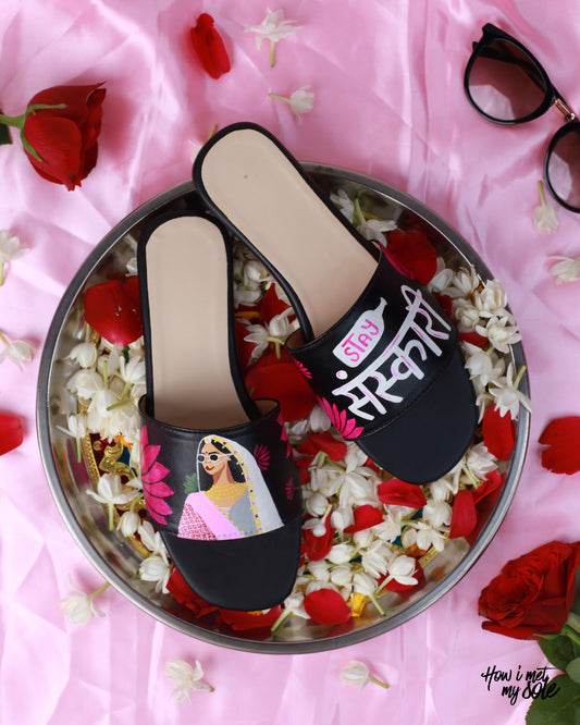Hand-Pained Sanskari Queens slides in a plate with flowers - top view 