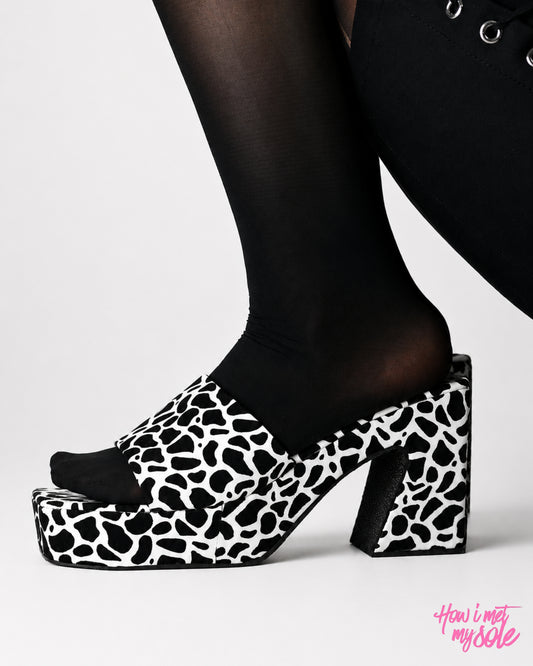 Women in 'Maleficent' Black & White PU Party Wear Open Toe Platform Heels - Side In Feet 1